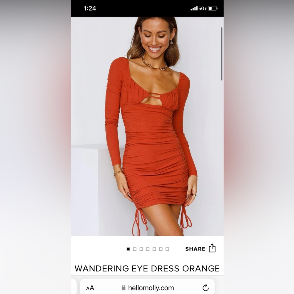 Orange tight fitted long sleeve dress. Open back Great material.!!